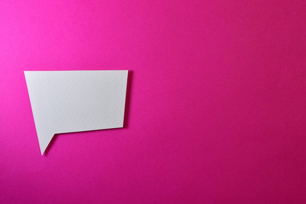 white chat logo on pink background